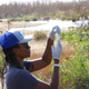 Rashema Ingraham analyzes a water sample.